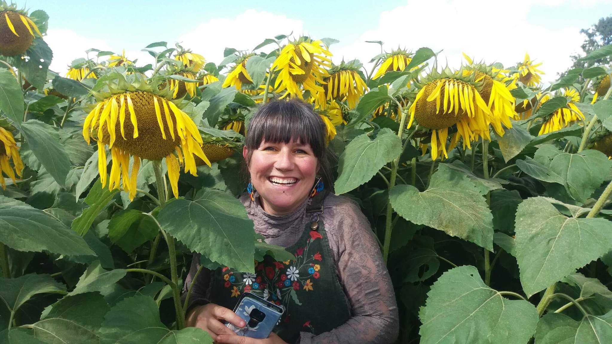 This is me. Giddy about flowers. A simple woman who wants to help make her corner of the world a better place to be!